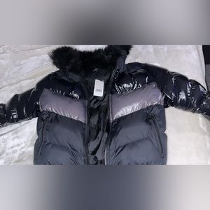 Black , leather, puffer jacket with fur at the top tag still on